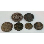 Collection of Roman coins and an Indian temple coin.