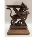 20th Century Burmese carved wood plant stand carved as a winged lion (Singa Bersayap) with mother of
