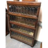 A Globe Wernick 'Classic' No.108½ oak four section bookcase with leaded glazed doors, width 85cm.