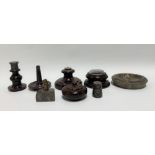 A collection of Cornish red serpentine wares including a candlestick (AF), a ring tree, a lidded