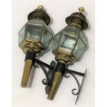 A pair of brass wall lanterns with hexagonal twelve glass shade etched with flowerheads, on