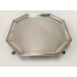 George VI silver octagonal tray with reeded border raised on four outswept legs, maker R & B,