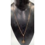 Early 20th Century 9ct gold pendant necklace, the drop pendant set with two clear stones, length