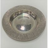 Good modern silver circular dish by Gerald Benney, the rim with a textured design, the well engraved