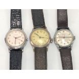 Three vintage gentlemans manual wind wristwatches, one by Garrard, the other by Bentina, the other