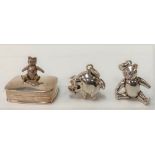 A modern silver hinge-lidded small pill box applied with an articulated teddy bear, export marks for