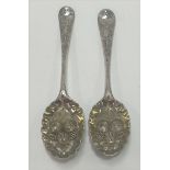 Two Georgian silver berry spoons of typical decoration, one maker TE, London 1759, the other maker