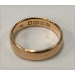 An 18ct hallmarked gold band ring, size L, weight 4.5g approx.