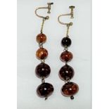 A pair of gold amber bead drop screw earrings, the largest bead of 6mm diameter approx, length of