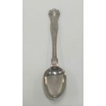 A Victorian silver dessert spoon by George William Adams, the hourglass handle cast with foliate