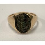 An 18ct gold blood stone set gentleman's signet ring, the matrix with carved armorial, size L,
