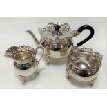 A good and substantial George VI silver three piece tea set of globular form with foliate scroll