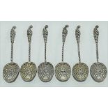 An Edwardian set of six coffee spoons with hollow finials and barley twist stems and with a