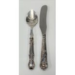 A butter knife and preserve spoon with silver hallmarked weighted handles (2).