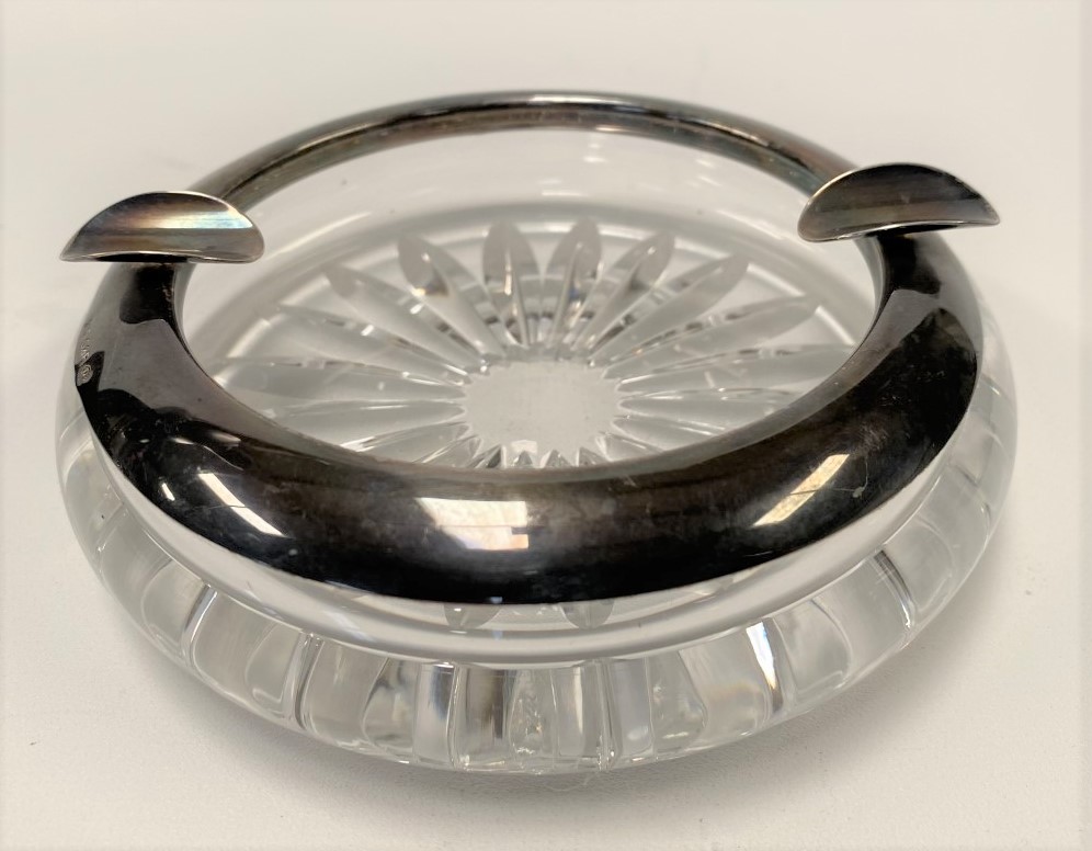 A white metal mounted cut glass ashtray, stamped S. & F. 925, diameter 12.5cm.