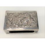 A Chinese silver matchbox case, the top embossed with a coiled dragon amongst clouds, character