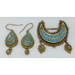Eastern yellow metal crescent shaped turquoise set brooch with two drops (one drop missing), width