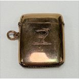 A George V 9ct hallmarked gold vesta case with engraved armorial, maker TAS, Chester 1911, length