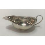 A George V silver sauce boat by Deykin & Harrison Limited, Birmingham 1930, length 13cm, weight 1.