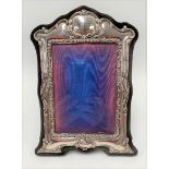 A modern Art Nouveau style silver applied blue velvet photograph frame, Birmingham 1989, aperture