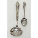 A Victorian silver sifter spoon with weighted handle and solid silver stem and bowl by George Unite,