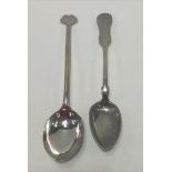 A Chinese white metal spoon with long handle and flattened finial, character marks to the back,