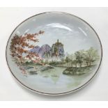 A 20th Century Chinese porcelain mountainous river landscape painted charger, diameter 40.5cm