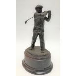 A modern bronze sculpture of a golfer upon a wooden socle, signed Gill Barker 1990, edition 12/