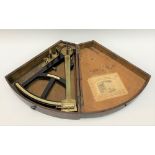 A 19th century oak cased sextant in brass and ebony and with ivory scales and tablet signed