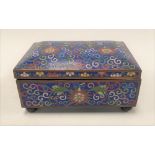 A Chinese cloisonné hinge-lidded rectangular box decorated with chrysanthemum amongst scrolls upon a