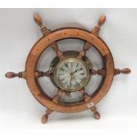 A modern ship's portal and wheel quartz wall clock by Plastimo, diameter overall 63cm