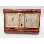 A travel clock barometer and thermometer by Angelus Sentry within brown crocodile leather case,