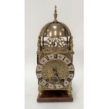 A brass lantern clock with later two-train movement, with silvered 6.25in chaptering with black