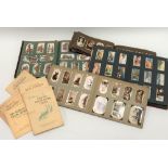 Album of cigarette cards, including Ogden's with a portrait of actors, a photographic set of dogs