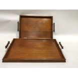 Pair of oak graduated rectangular twin handle trays, width of largest 58cm
