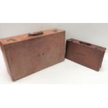 A pig leather rectangular suitcase, width 66cm; together with a small leather suitcase, width