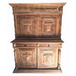 A 19th century continental oak cupboard, the raised back with a pair of cupboard doors with gilded