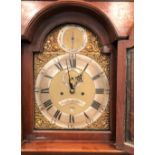 An eight day long case clock, the 12in brass arched dial with silvered chaptering signed JNO