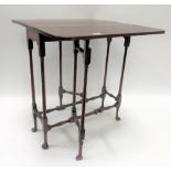 A 19th Century mahogany spider leg table, the square top over six slender supports united by
