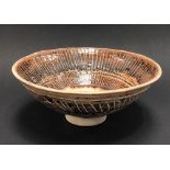 A Studio Pottery porcelain bowl with brown glaze and incised line decoration in the style of Lucie