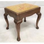 A George III style stool with woolwork inset over cabriole legs, width 53cm