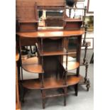 Victorian wotnot with three mirrored panels and shelves with ring turned supports, width 94cm.