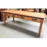A late 19th Century farmhouse table, the mahogany top with moulded edged over the rustic pine base