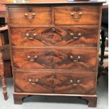 An early 20th century mahogany straight front chest of two short over three long graduated drawers