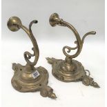 A pair of Edwardian brass scroll wall lights, height of plate 30cm