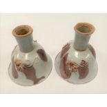 Pair of Chinese porcelain red oxide brushwork underglaze pedestal wine cups, each bowl applied