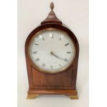 A mahogany cased timepiece with 4.5in white enamel dial with black Roman Numerals and signed Comitty