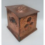 An Arts & Crafts copper hinge-lidded coal bin of square tapered section and with twin handles, width