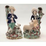 Pair of Victorian Staffordshire Pottery figural spill vases, one modelled as a shepherdess with