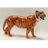 A Beswick Pottery model of a tiger, length 30cm.